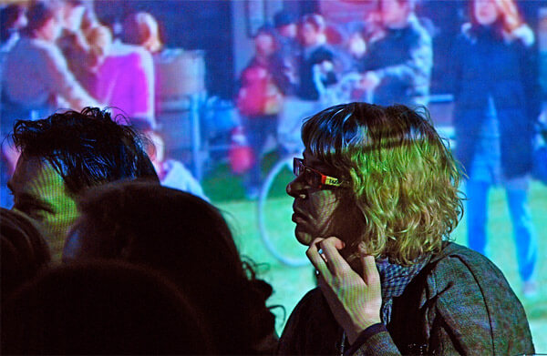 Audience members watch a Pecha Kucha presentation in Tokyo. (CC) Photo by Ami Harikoshi