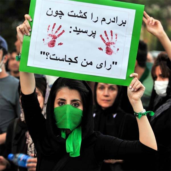 A protester on the streets of Iran, June 17, 2009. The sign reads "They Killed My Bro Koz He Asked "Where's My Vote." Creative Commons photo by Hamed Saber.