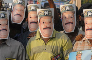 Tamil protesters wear masks of LTTE leader Velupillai Prabhakaran. Photo by Babu Babu/Reuters.