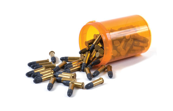 Bullets spilling from a pill container