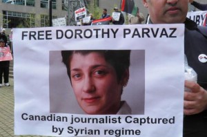 A protester at a Vancouver demonstration calling for Canadian al Jazeera journalist Dorothy Parvaz to be freed by Syria's government. Photo by al Jazeera/Isaac Oomen.